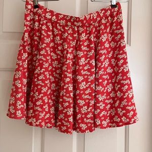 American Eagle brand. Size Medium. Soft orange floral.